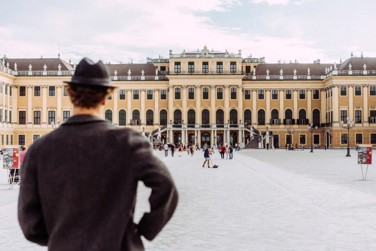 Schönbrunn Palace A man in a hat looks out over Schönbrunn Palace in Vienna.