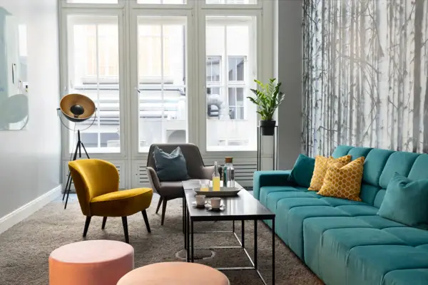 Coworking Space A living room with sofa, armchairs and coffee table.