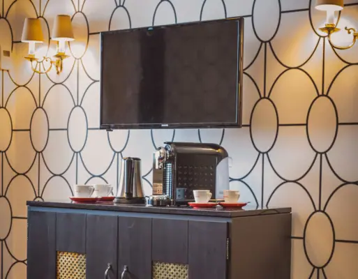 Coffee station A television on a cabinet