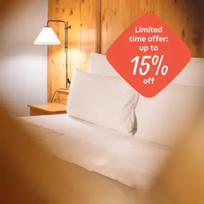 Autumn Special A bed with white pillows and a lampshade.