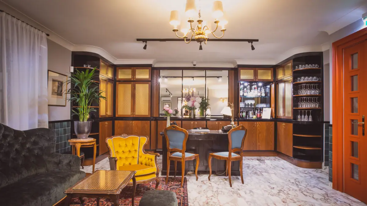 Lounge A room with a table and chairs.