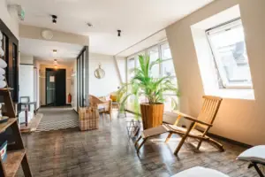 Relaxation area with loungers A room with deckchairs and a plant.