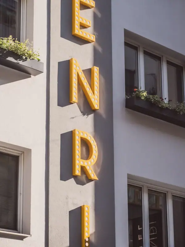 Facade A building with a sign on the side.