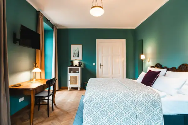 Bedroom A bedroom with a desk and a bed.