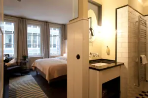 M-Studio Hotel room with bed and washbasin