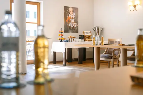 Room Ache Gallery 1 in the HENRI Hotel Kitzbühel A table with food and drinks on it.