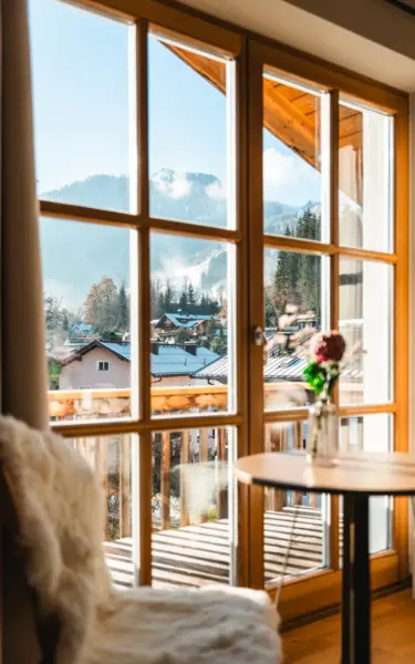 A river running through a building with trees and clouds in the background.