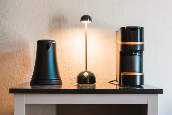 Coffee and tea station Coffee machine and cups on a shelf