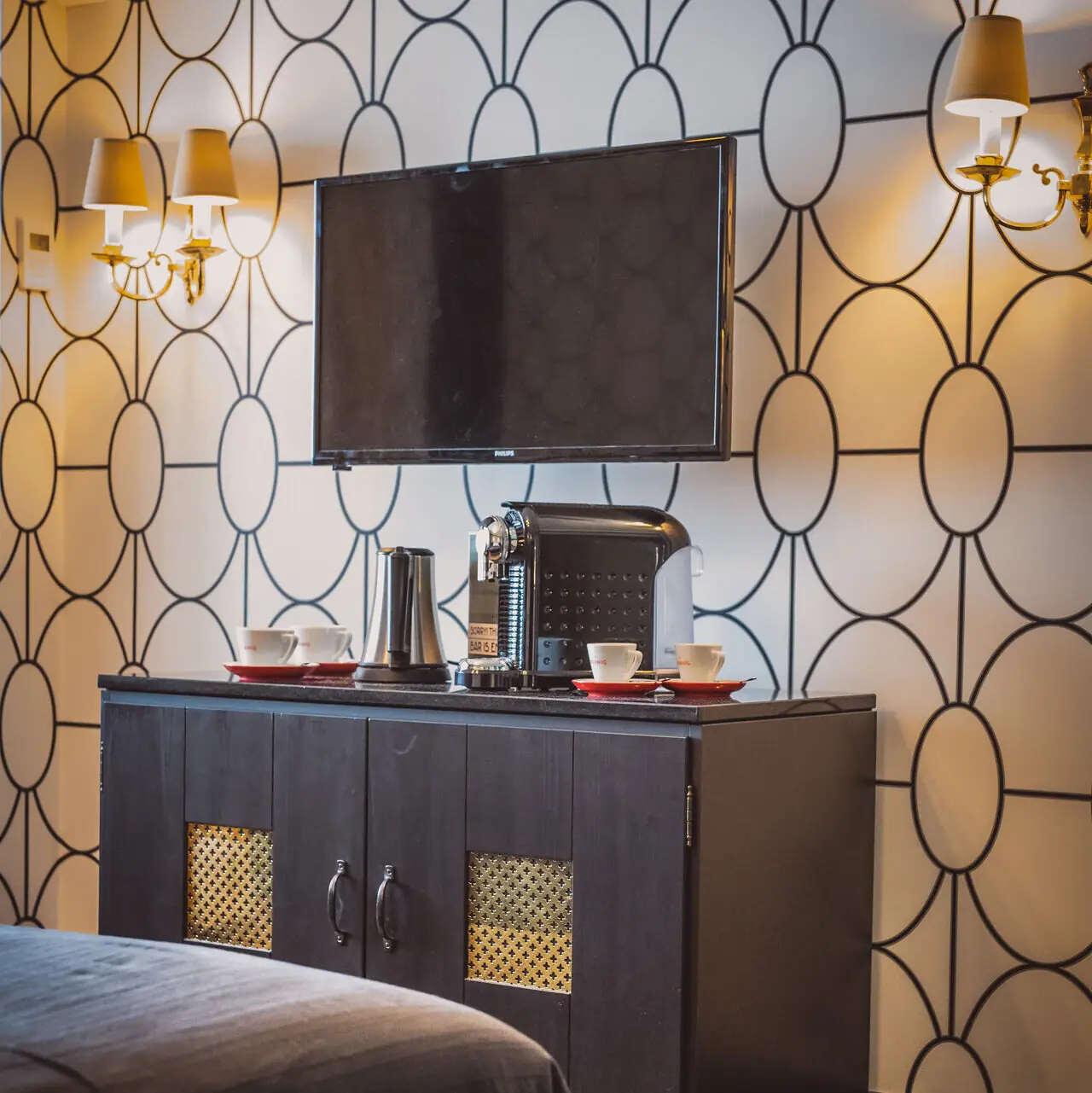 Coffee station A television on a cabinet.