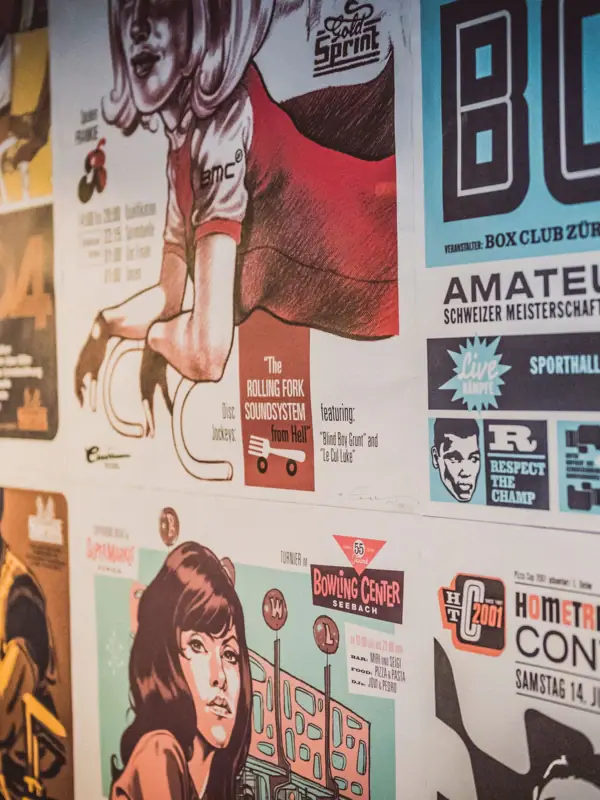 Poster with comic drawings A wall with several posters.