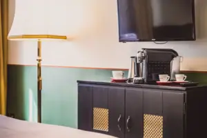 Coffee station A television on a cabinet.