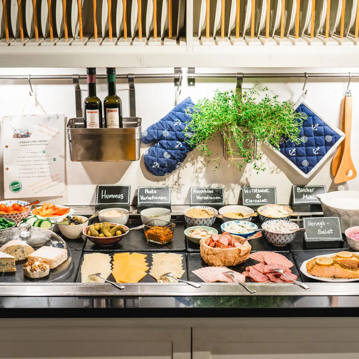 Breakfast buffet A counter at the breakfast buffet with food on it.
