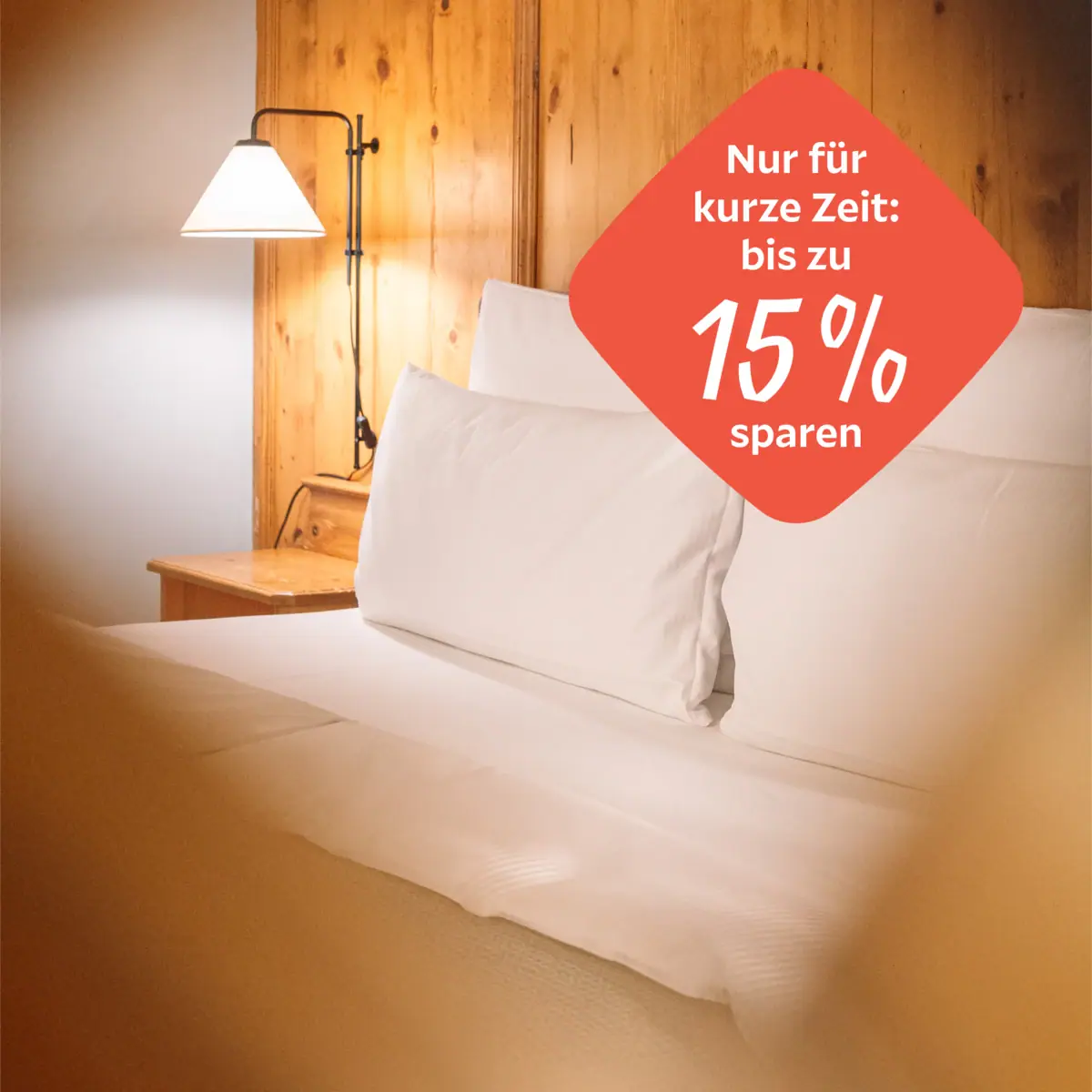 Autumn Special A bed with white sheets and a lamp.
