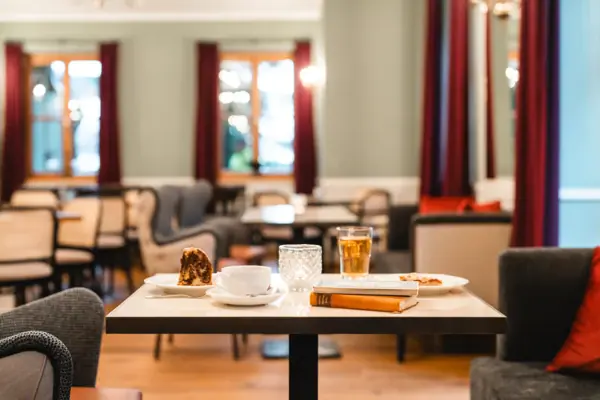 Hall of Mirrors at the HENRI Hotel Kitzbühel A table with various dishes on it.