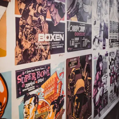 Poster with comic pictures A wall with posters.