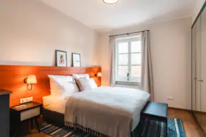 Bed Bed with wooden headboard and lamp in the bedroom.