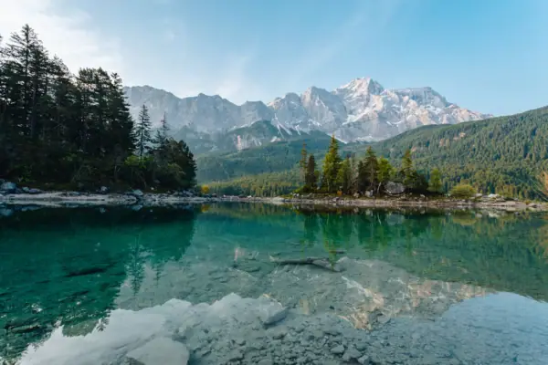 Eibsee with mountain panorama Lake Eibsee with trees and mountains in the background