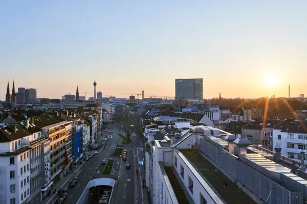 Düsseldorf City view with buildings and a tower in the background in daylight.