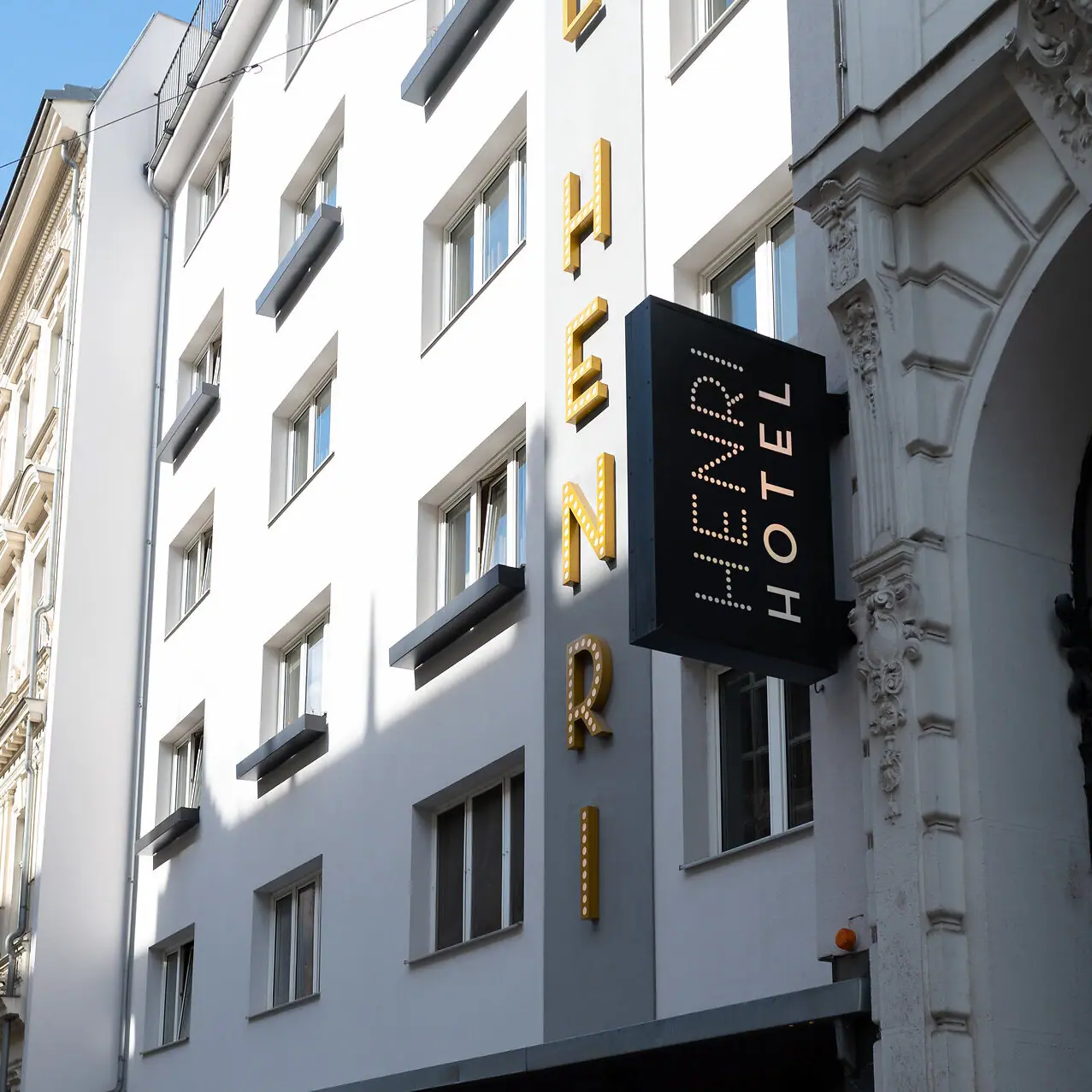 HENRI Hotel Vienna A sign on a building.