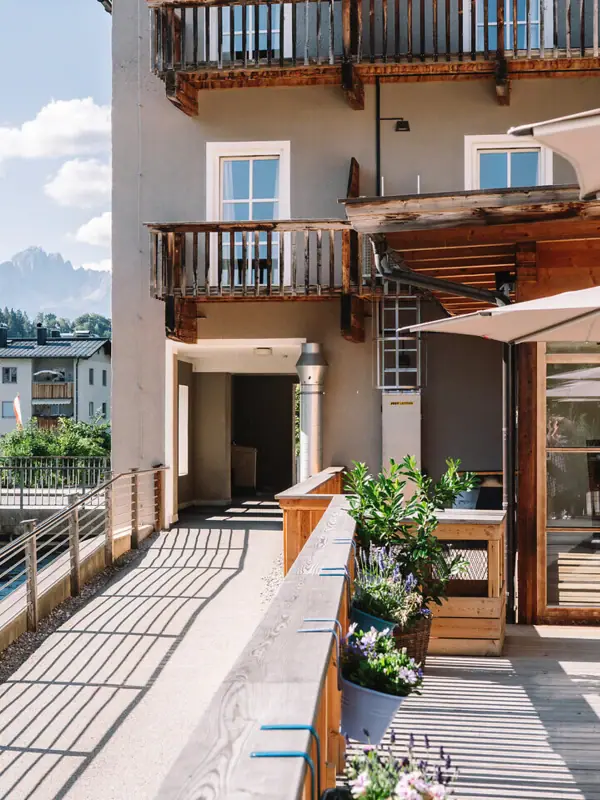 Terrace A building with a terrace and parasols.