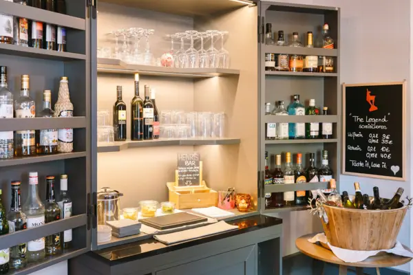 Bar A liqueur cabinet with bottles and glasses.