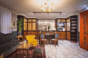 Lounge A room with a table and chairs.