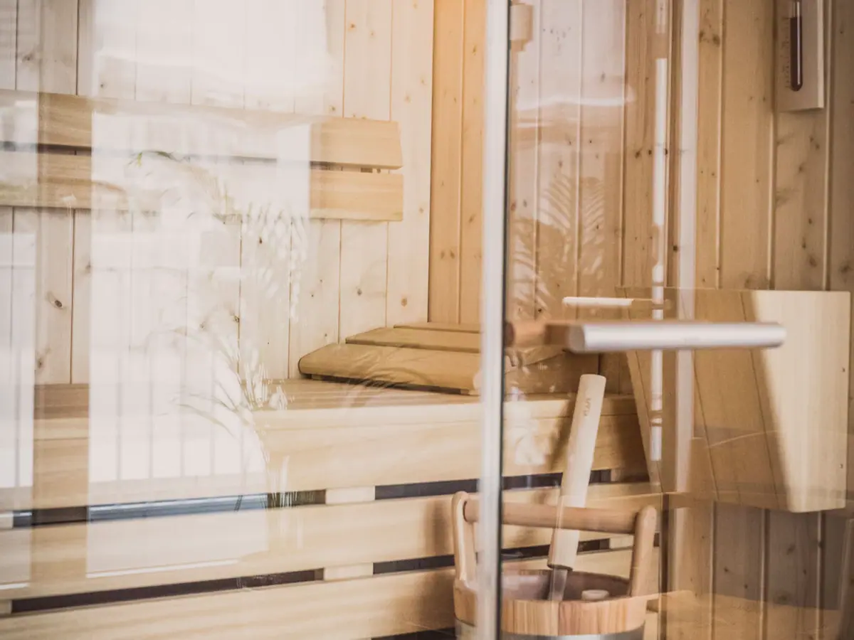 Sauna at HENRI Düsseldorf A wooden bucket in a sauna.