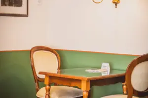 Sitting area A table and chairs in one room.