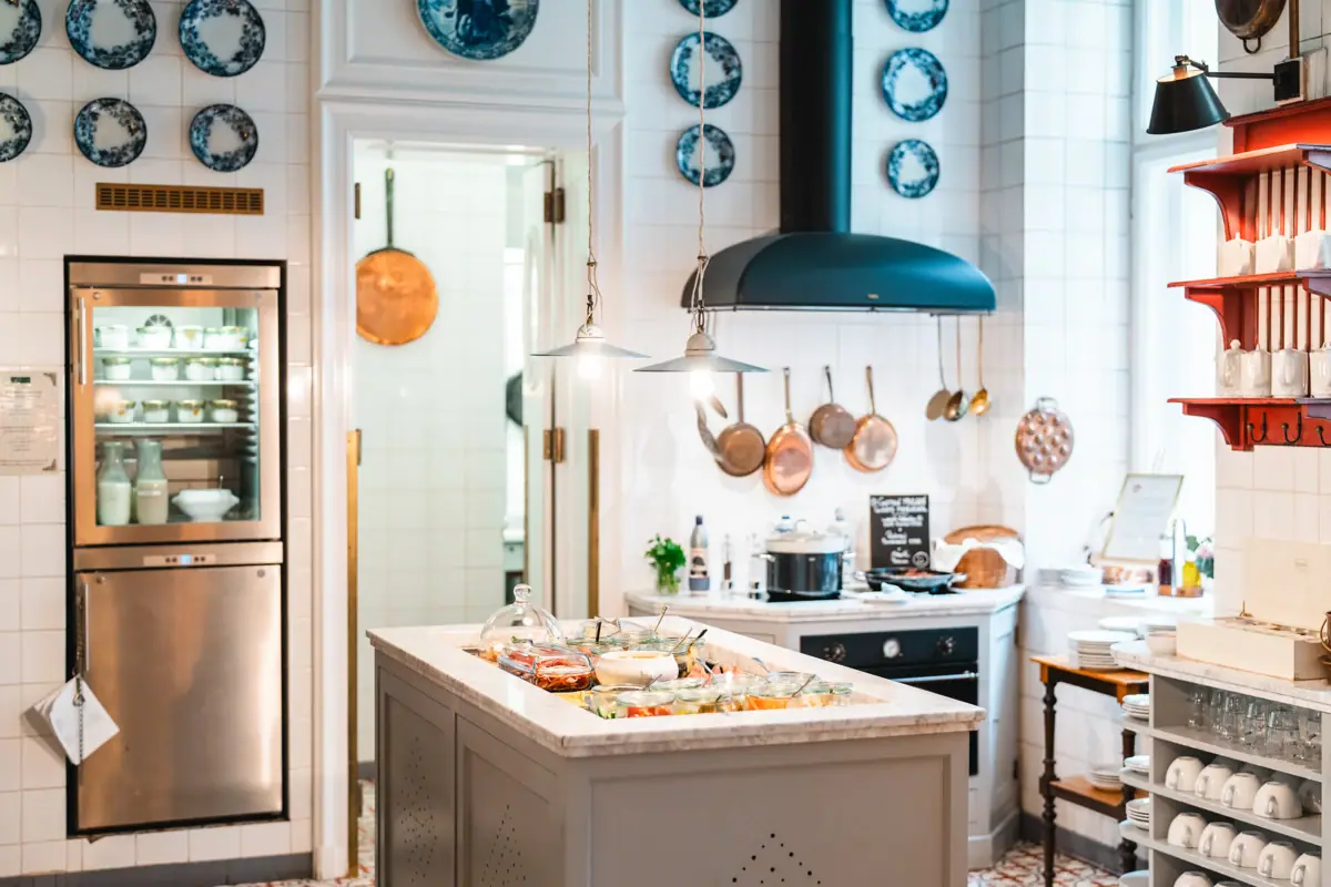 HENRI Berlin Kitchen A kitchen with a large island on which food is placed.