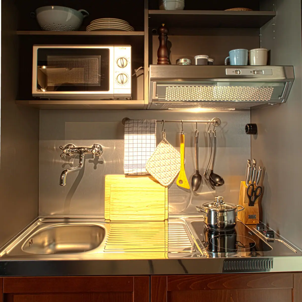 Kitchenette Small kitchen island with sink, two hobs and microwave