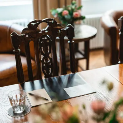 Event location HENRI Berlin Wooden table with chairs and meeting documents