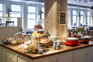Breakfast buffet with muesli and jams Kitchen island with muesli, cereals and jams.