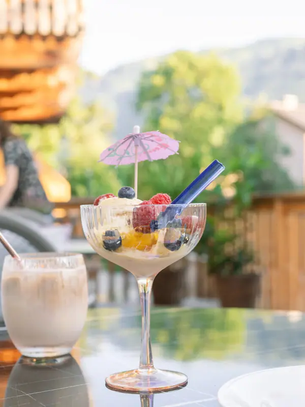 Ice cream and coffee A table with desserts and drinks.