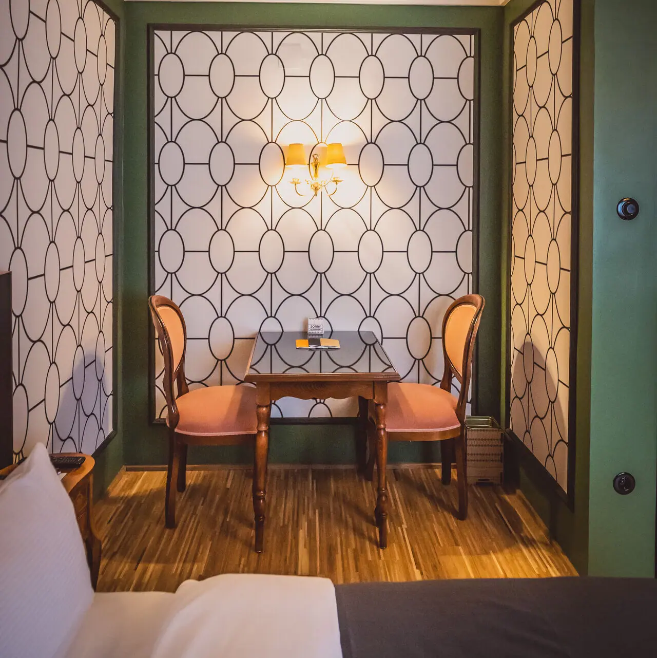 Sitting area A table and chairs in one room.