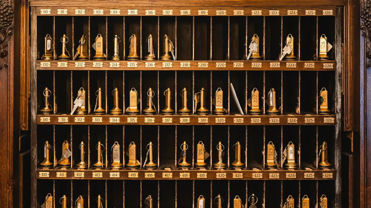 Key board at the reception desk at HENRI Berlin Key cabinet with many room keys