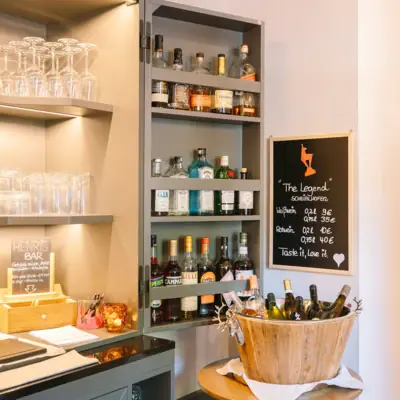 Bar A shelf with bottles of alcohol.