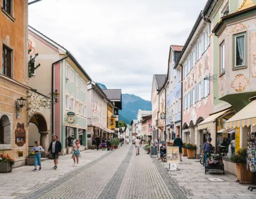 Old town in the mountains Street with buildings and people taking a walk