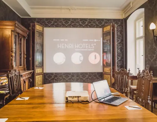 HENRI Berlin conference room A meeting room with a table and a projector.