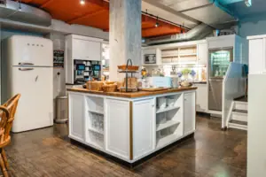 Open kitchen at the HENRI Hotel Hamburg Kitchen with a large kitchen island and breakfast buffet