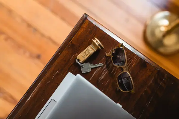 HENRI Berlin wooden table Keys and sunglasses on a table